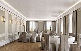 Zwei goldene Eheringe auf einem dekorativen Untergrund.